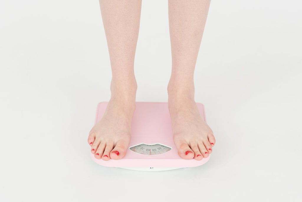 Premium Photo  Weight scale diet pink